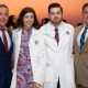 Cousins Jake and Emily Rienzo join their fathers and proud SGU graduates to accept their white coats at the Spring 2020 School of Medicine White Coat Ceremony
