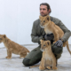Andrew Kushnir, DVM '19, with rescued lion cubs from Ukraine-Russia war