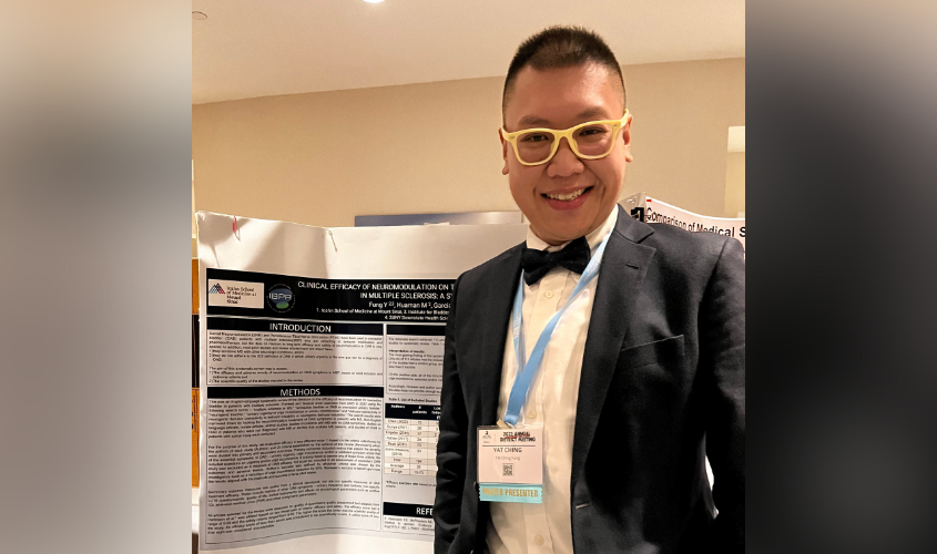 Dr. Fung posing with his trifold board of research