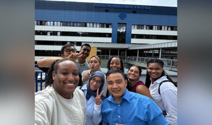 A group of SOM students standing in front of Motol Hospital in Prague