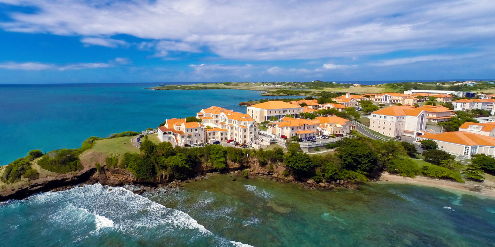 Photo of SGU campus surrounded by water and blue sky